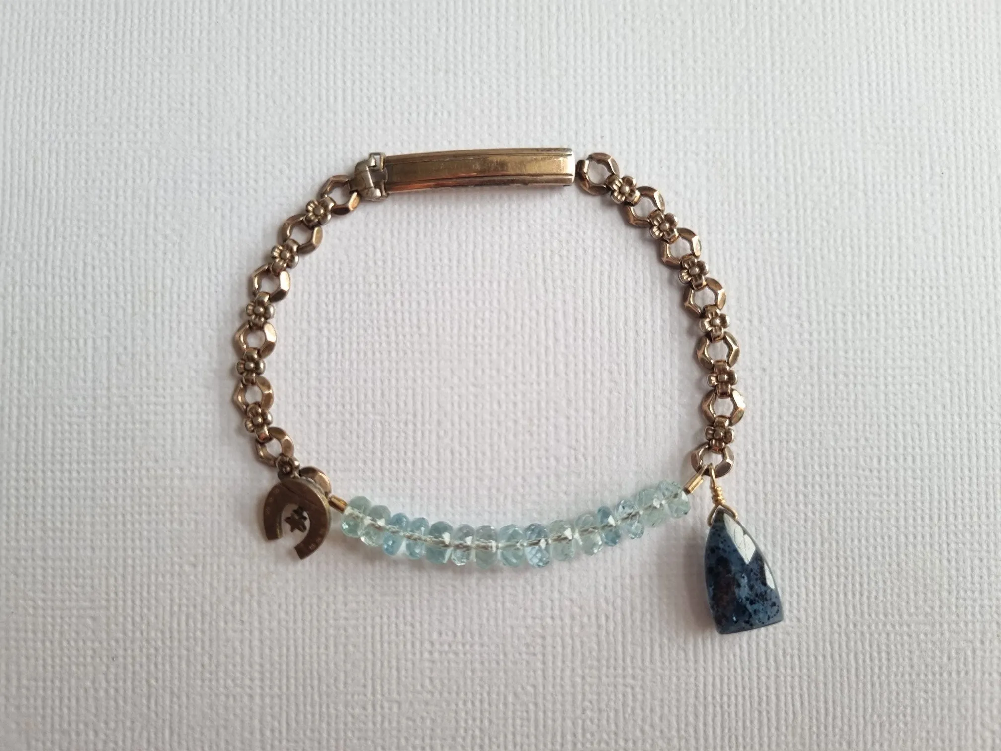 lucky charm bracelet | vintage watch band bracelet with aquamarine kyanite and antique horseshoe charm