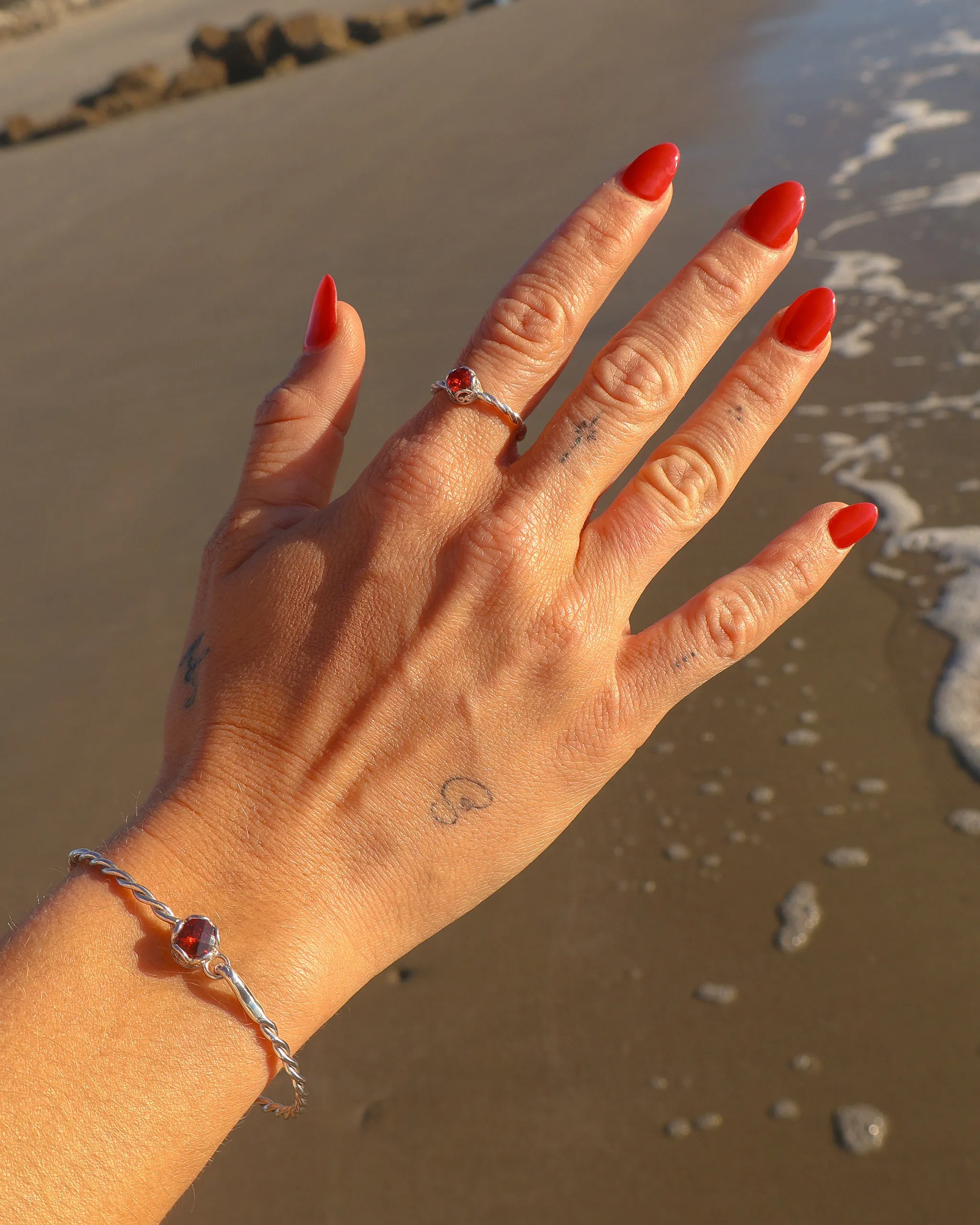 Princess Petroglyph Twisted Bangle - Red Zircon