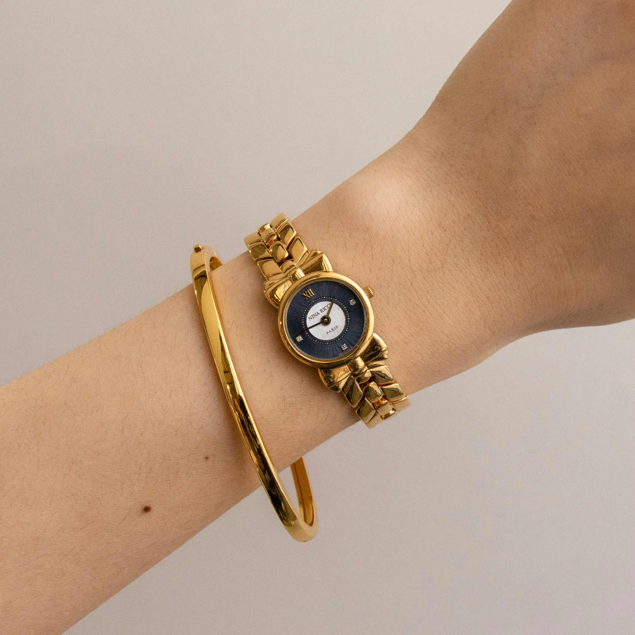 Vintage Nina Ricci Swiss Midnight Bow Gold Watch