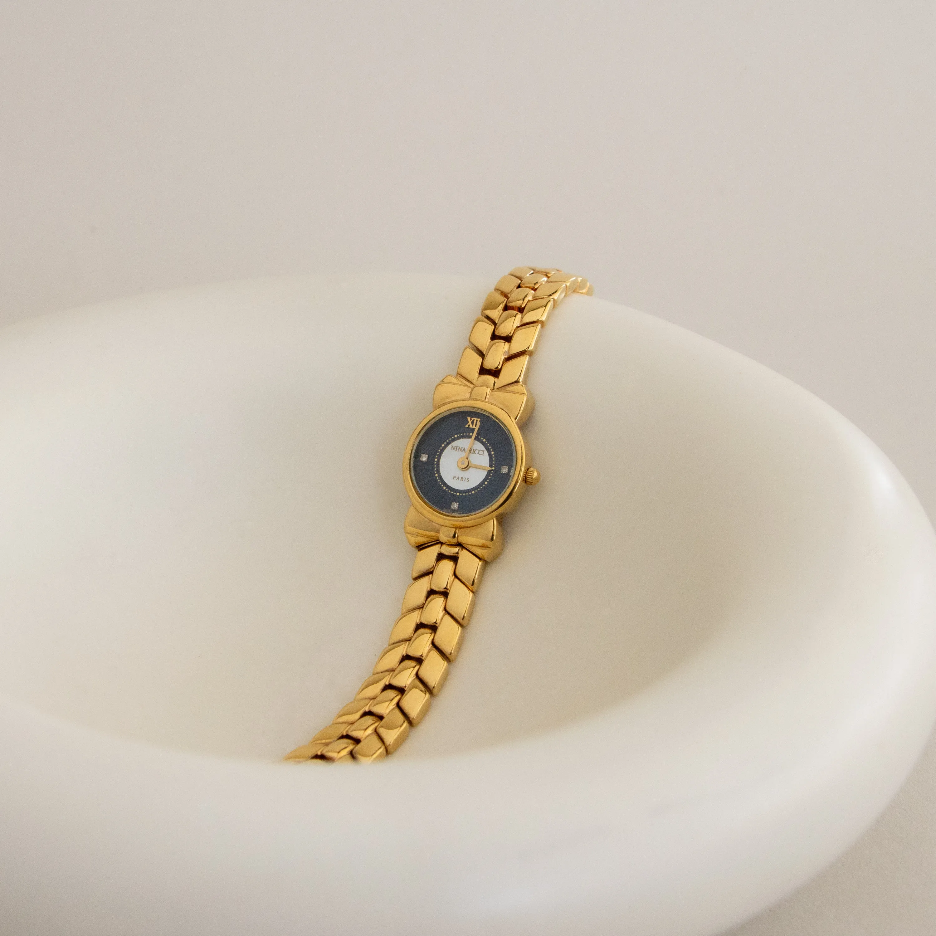 Vintage Nina Ricci Swiss Midnight Bow Gold Watch